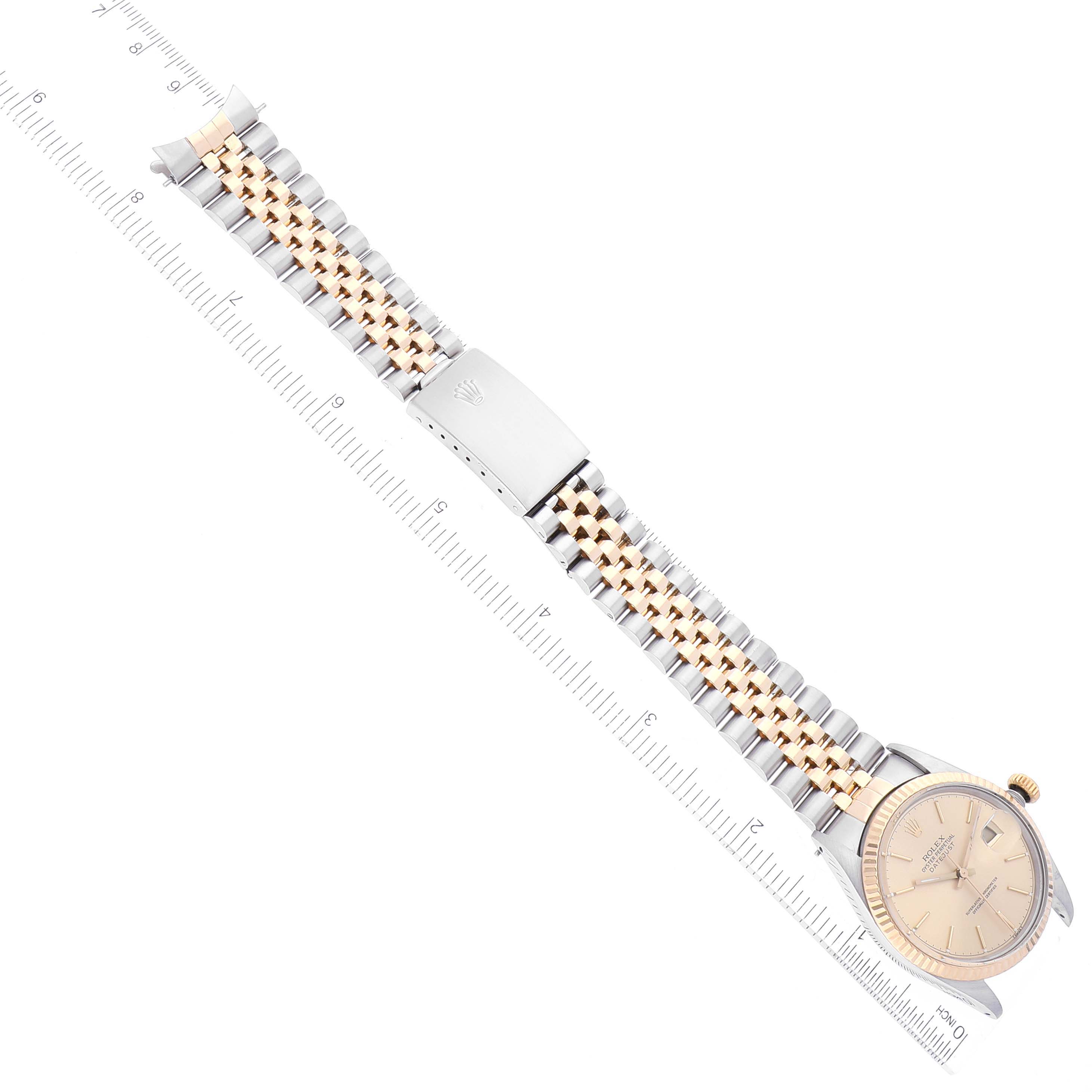 The Vintage Collection Rolex watch is shown from a top-down angle, displaying its face, bezel, and two-tone bracelet with a clasp.