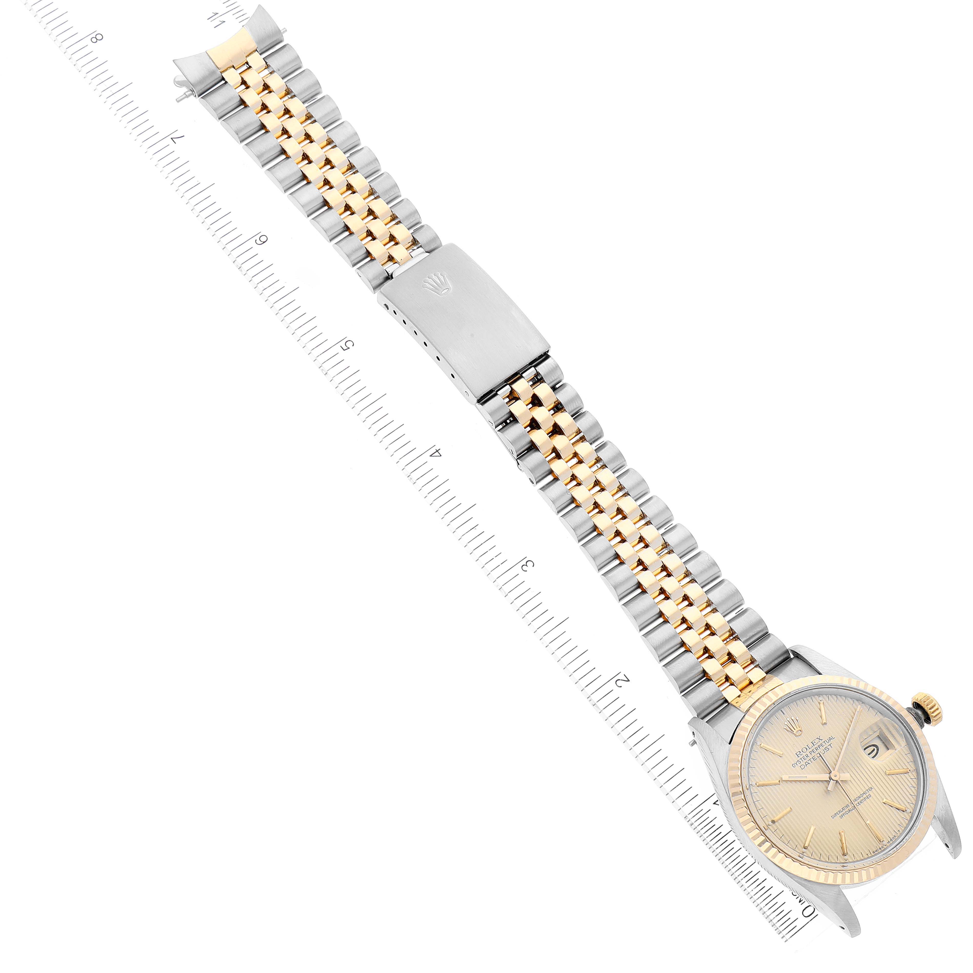 The Rolex Vintage Collection 16013 Men's Steel and Gold (two tone) Champagne Dial 16013 Men's Steel and Gold (two tone) Champagne Dial model watch is shown from an overhead angle, displaying its face, bezel, crown, and two-tone bracelet with the clasp.