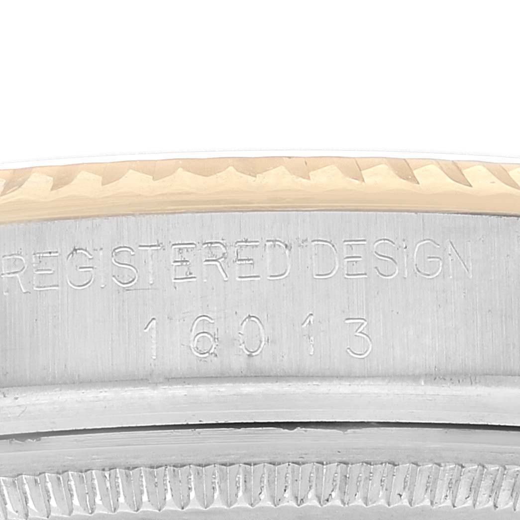 This image shows a close-up of the case back engraving on a Rolex Vintage Collection 16013 Men's Steel and Gold (two tone) Champagne Dial 16013 Men's Steel and Gold (two tone) Champagne Dial model, featuring the serial number and "REGISTERED DESIGN."