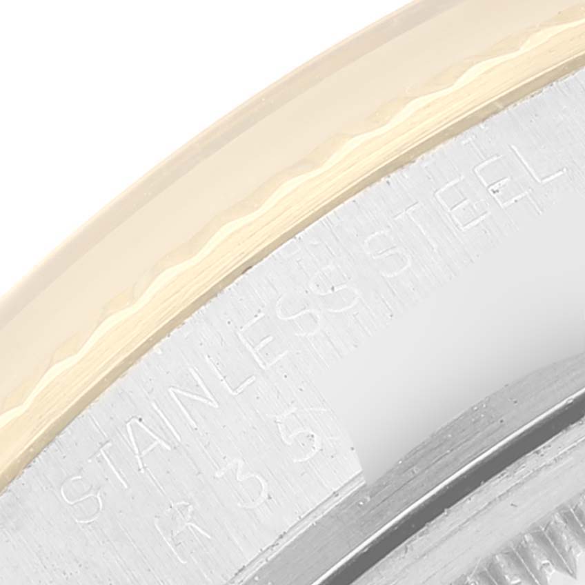 The image shows a close-up of the case edge with stainless steel engraving of a Rolex Vintage Collection 16013 Men's Steel and Gold (two tone) Champagne Dial 16013 Men's Steel and Gold (two tone) Champagne Dial watch.