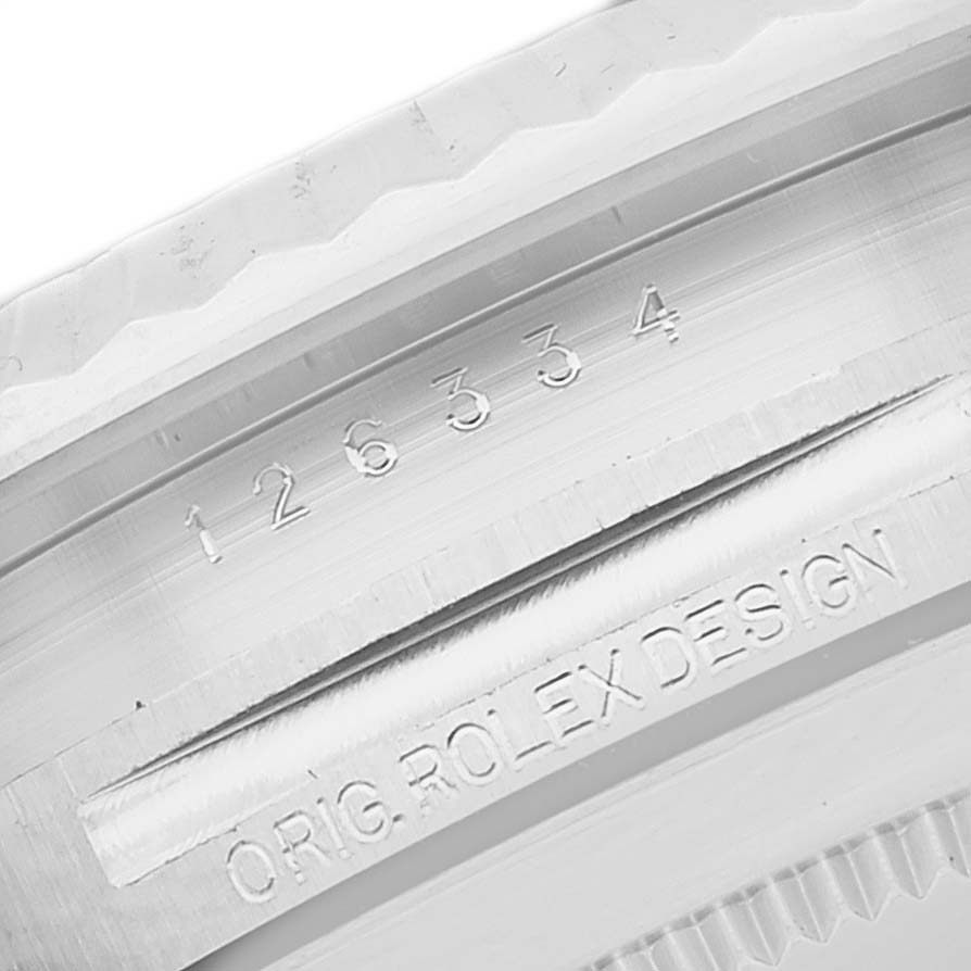 The image shows a close-up angle of the bezel and serial number engraving on a Rolex Datejust 41 126334 Men's Stainless Steel Black Dial 126334 Men's Stainless Steel Black Dial watch.