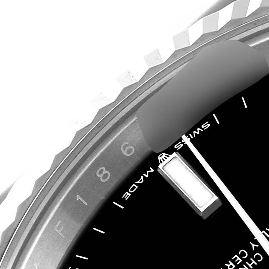 The image shows a close-up of the dial and fluted bezel of a Rolex Datejust 41 126334 Men's Stainless Steel Black Dial 126334 Men's Stainless Steel Black Dial watch, focusing on the 6 o'clock index.