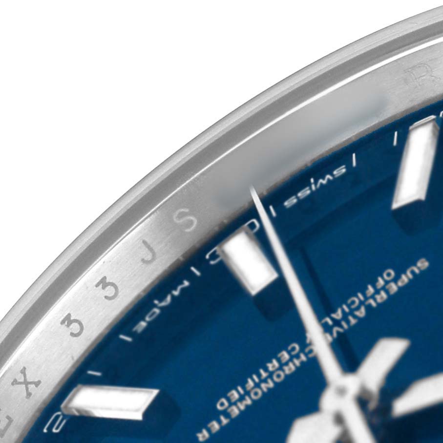 The image shows a close-up of the bezel and a portion of the blue dial of a Rolex Datejust 41 126334 Men's Stainless Steel Blue Dial watch.
