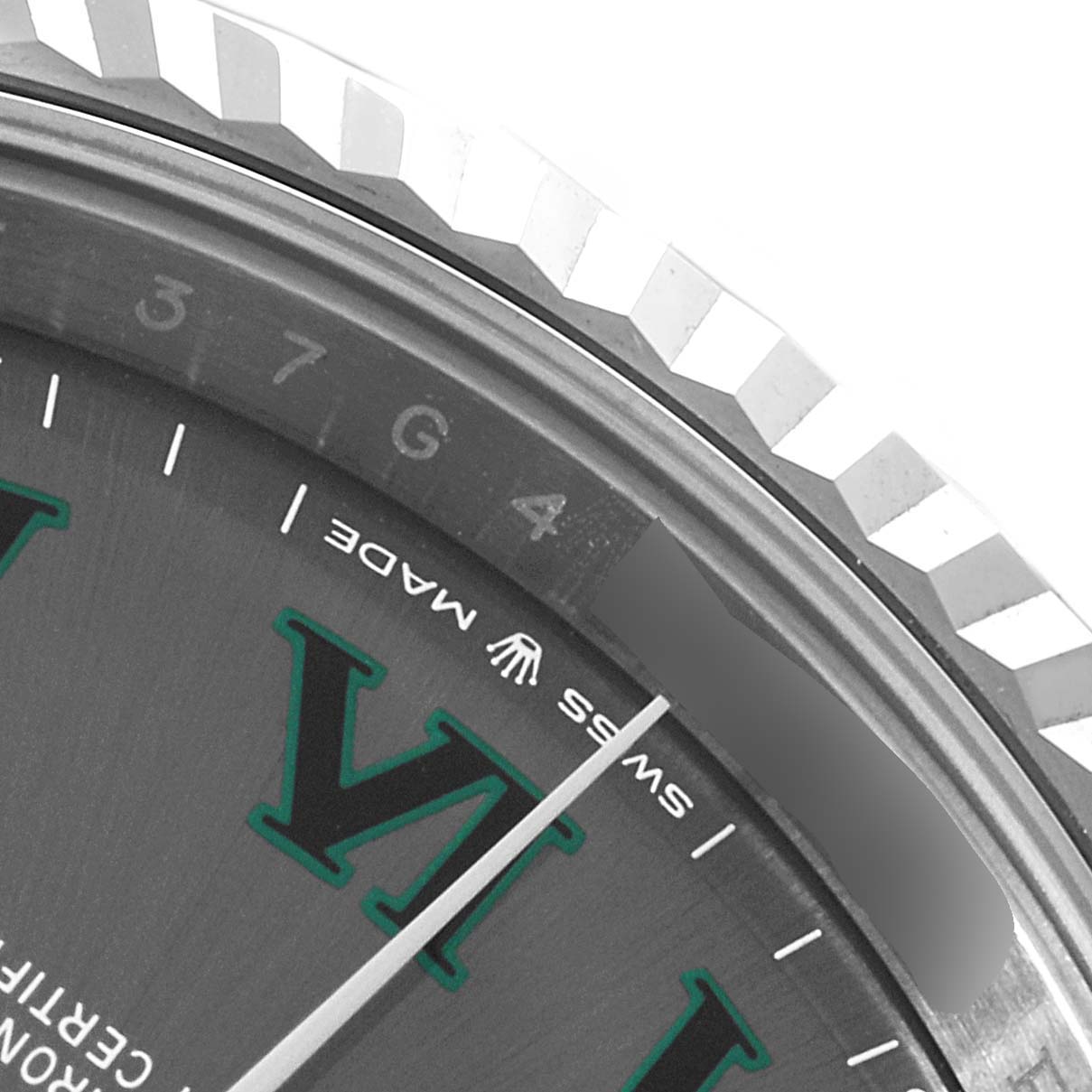 This image shows a close-up of the bezel and part of the dial of a Rolex Datejust 41 126334 Men's Stainless Steel Grey Dial 126334 Men's Stainless Steel Grey Dial, highlighting the brand name and Swiss Made label.