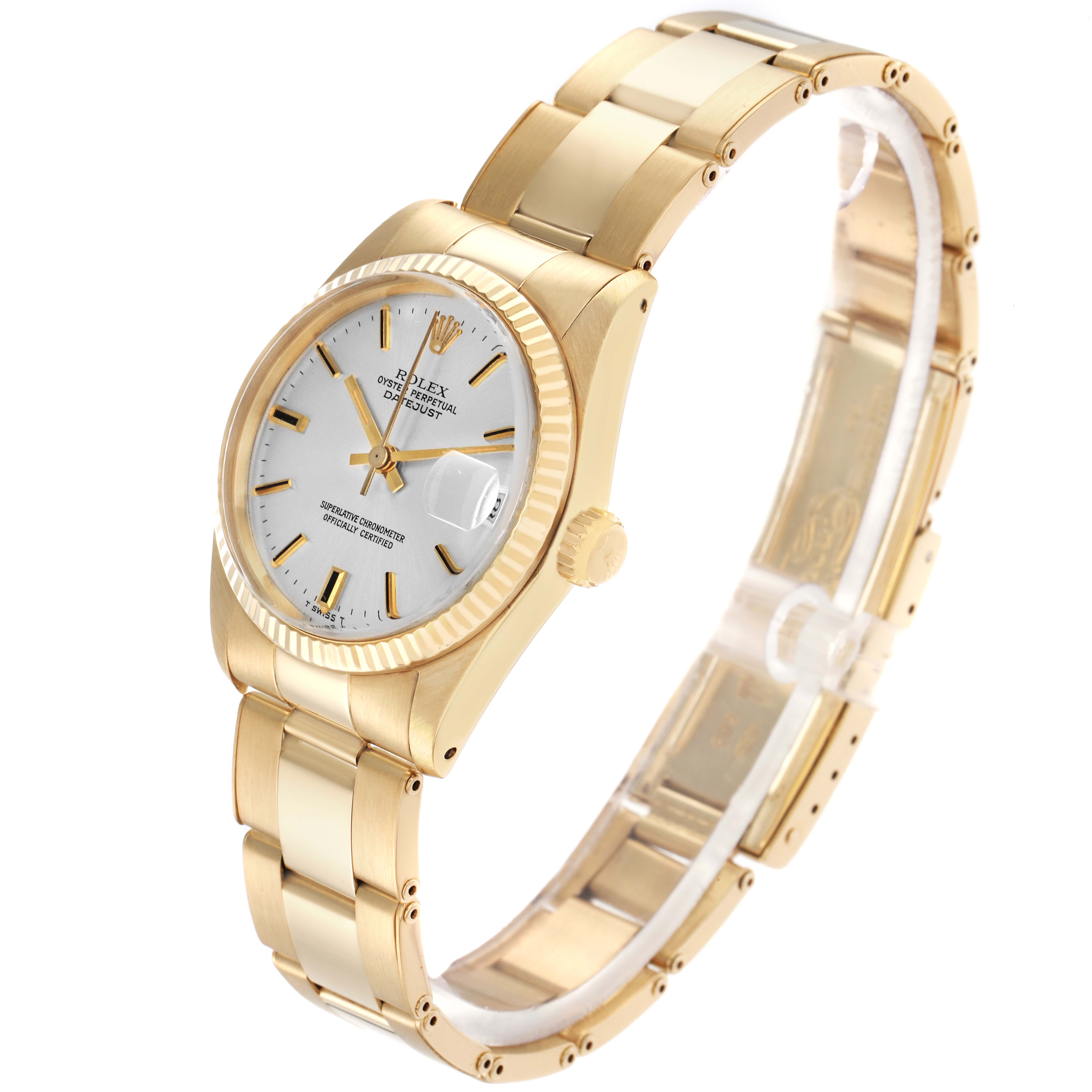 The Rolex Vintage Collection model 6827 is shown at a slight angle highlighting the gold case, fluted bezel, white dial, hands, and part of the gold bracelet.