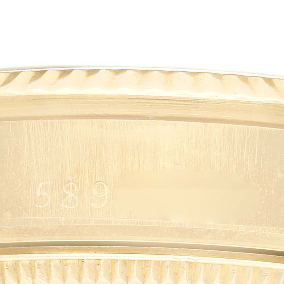 The image shows a close-up of the Rolex Vintage Collection model 6827, specifically the edge of the watch case with visible engravings.