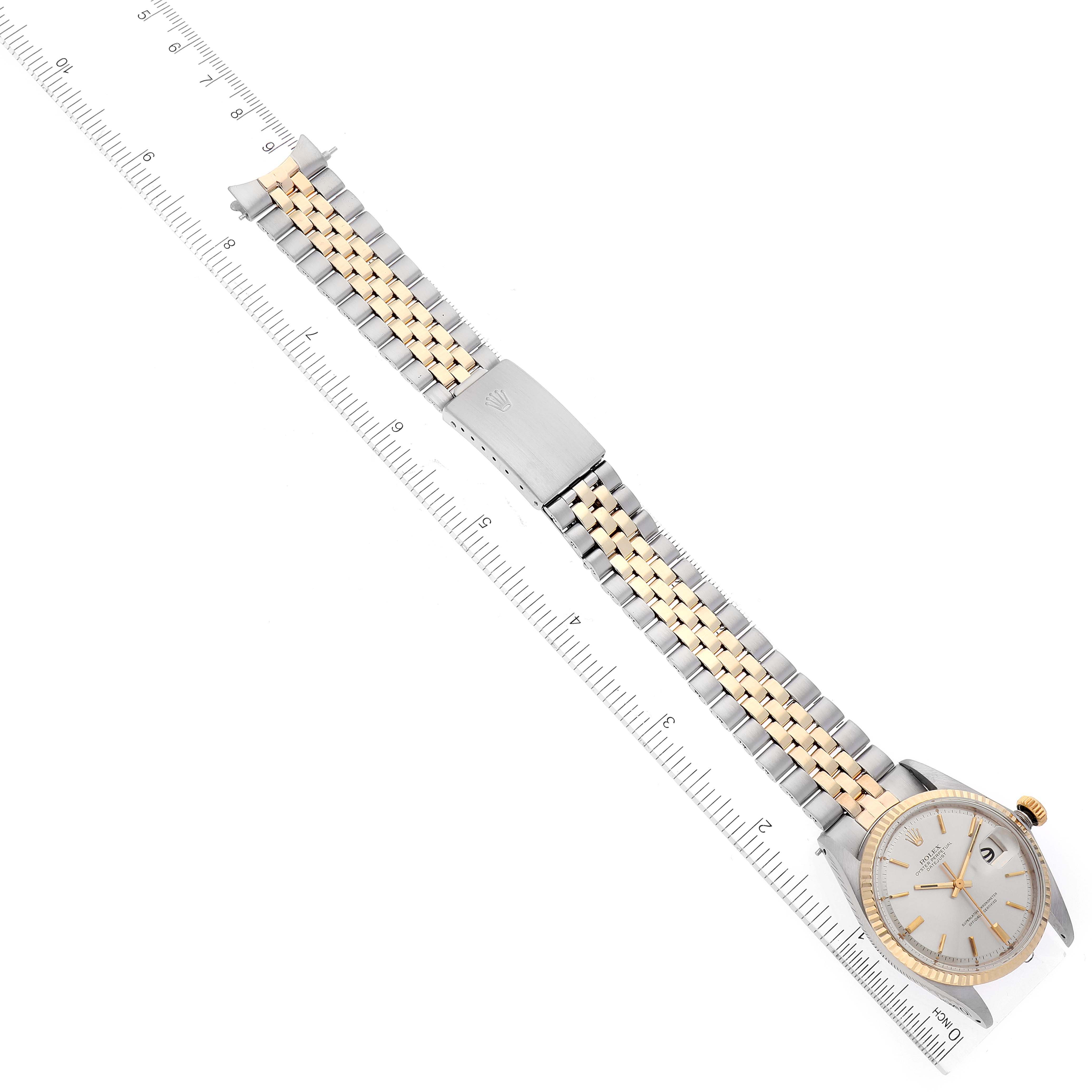 The image shows the Vintage Collection model by Rolex from a top-down angle, displaying the watch face, bracelet, and a ruler for measurement.