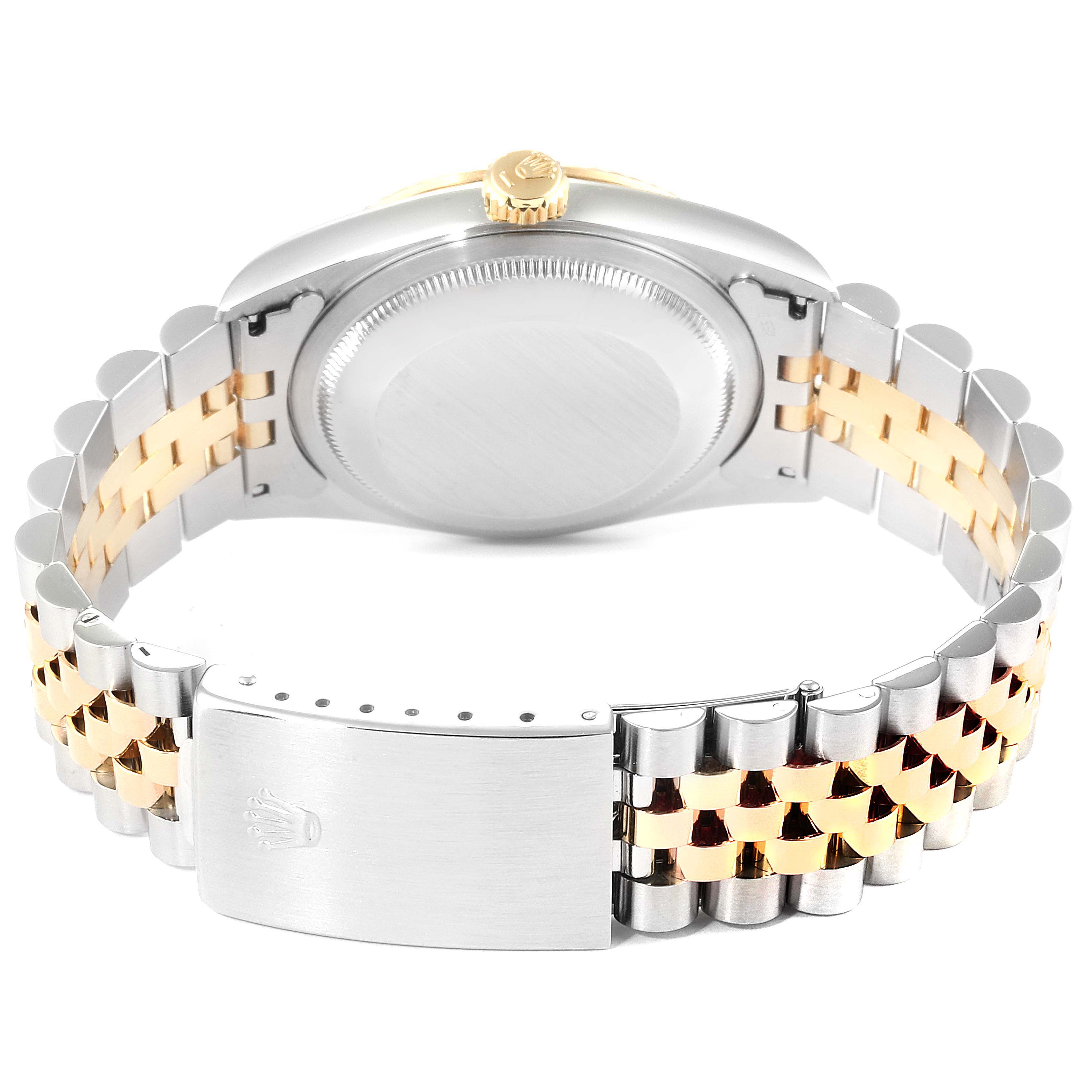 The image shows the rear angle of a Rolex Datejust 16233 Men
s Steel and Gold (two tone) Champagne Dial 16233 Men
s Steel and Gold (two tone) Champagne Dial watch, highlighting its case back, crown, and two-tone jubilee bracelet with clasp.