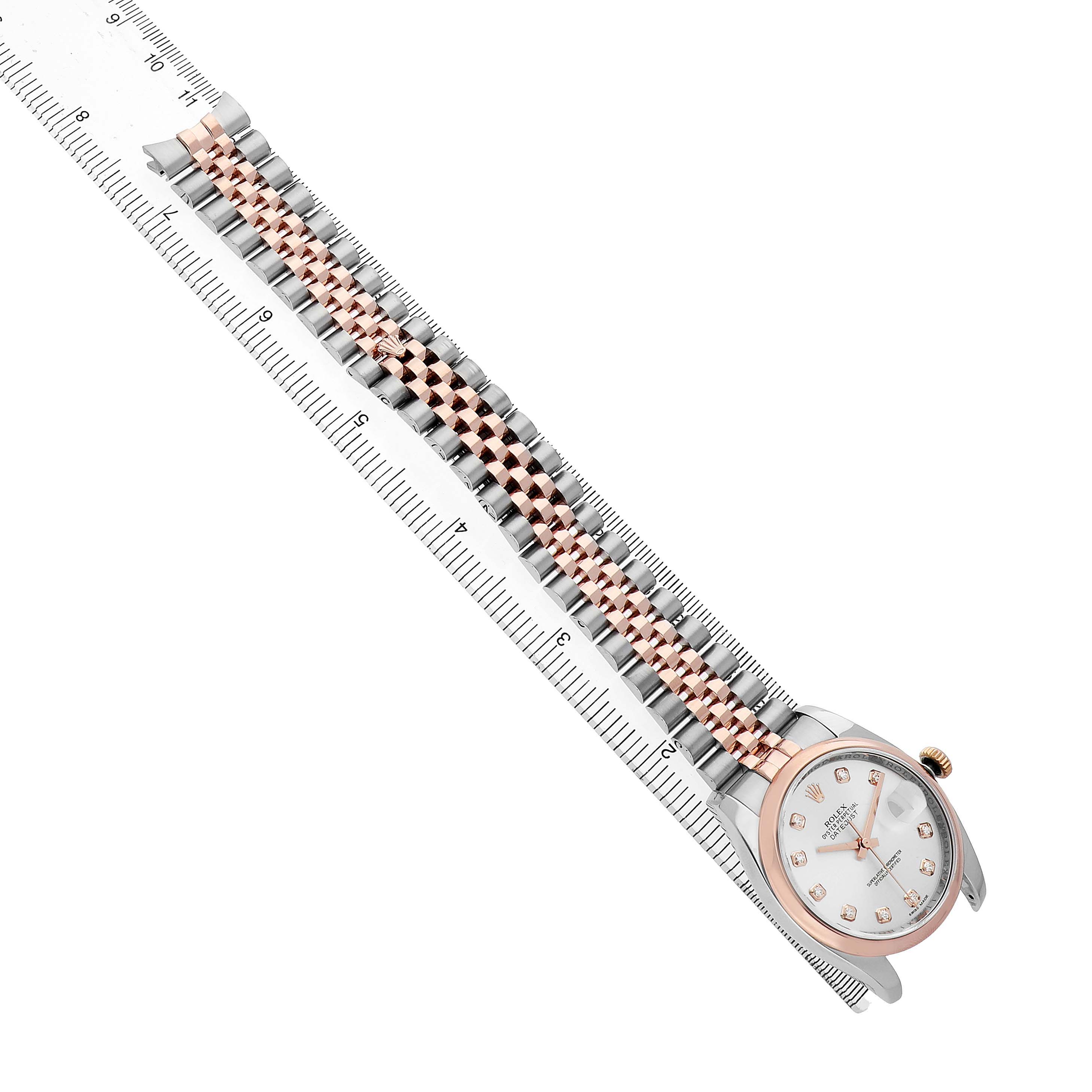 The image shows a Rolex Datejust 116201 Men's Steel and Gold (two tone) Silver Dial watch from an overhead angle, highlighting the two-tone bracelet and the face with hour markers.