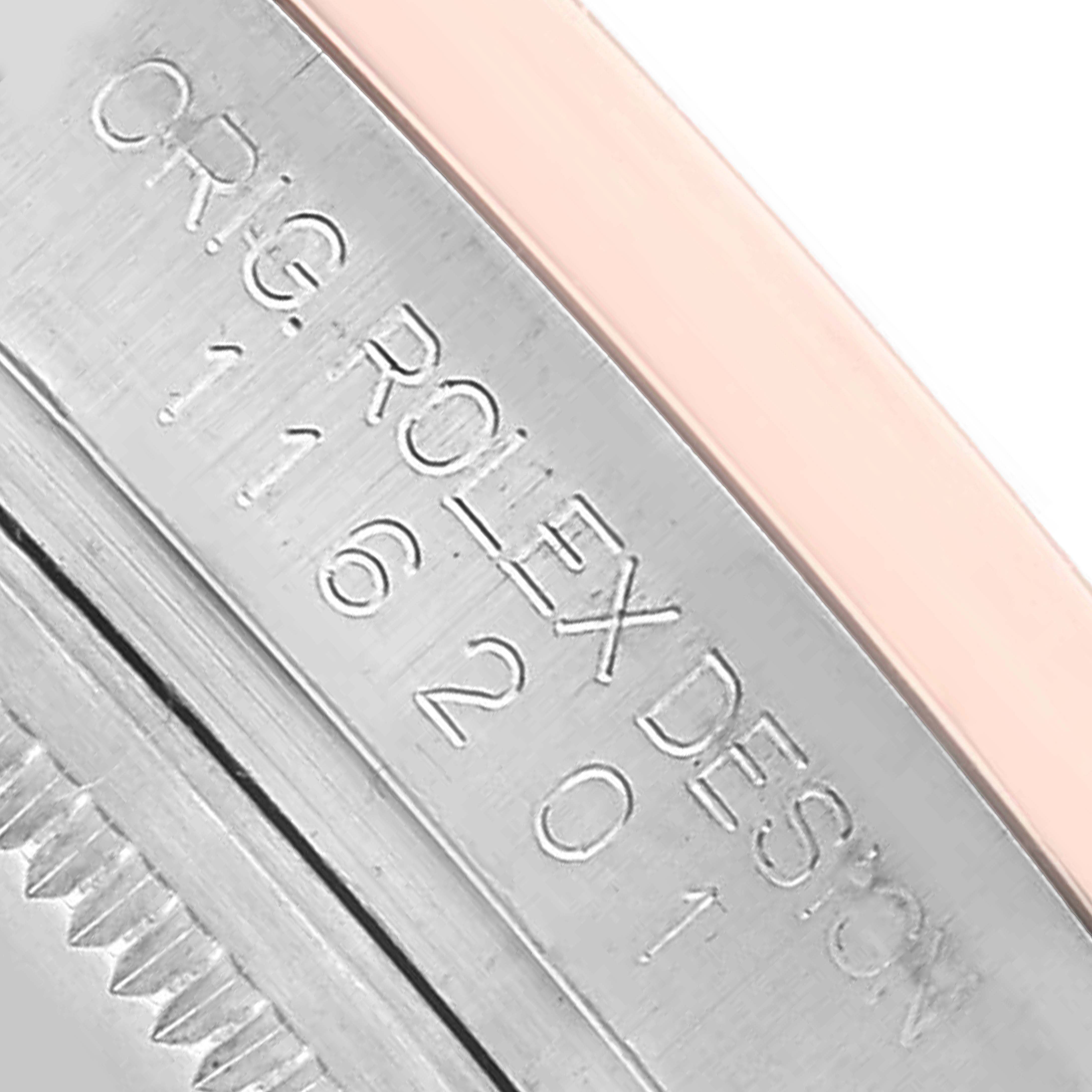 The image shows a close-up of the side of a Rolex Datejust 116201 Men's Steel and Gold (two tone) Silver Dial case, highlighting engraved text.
