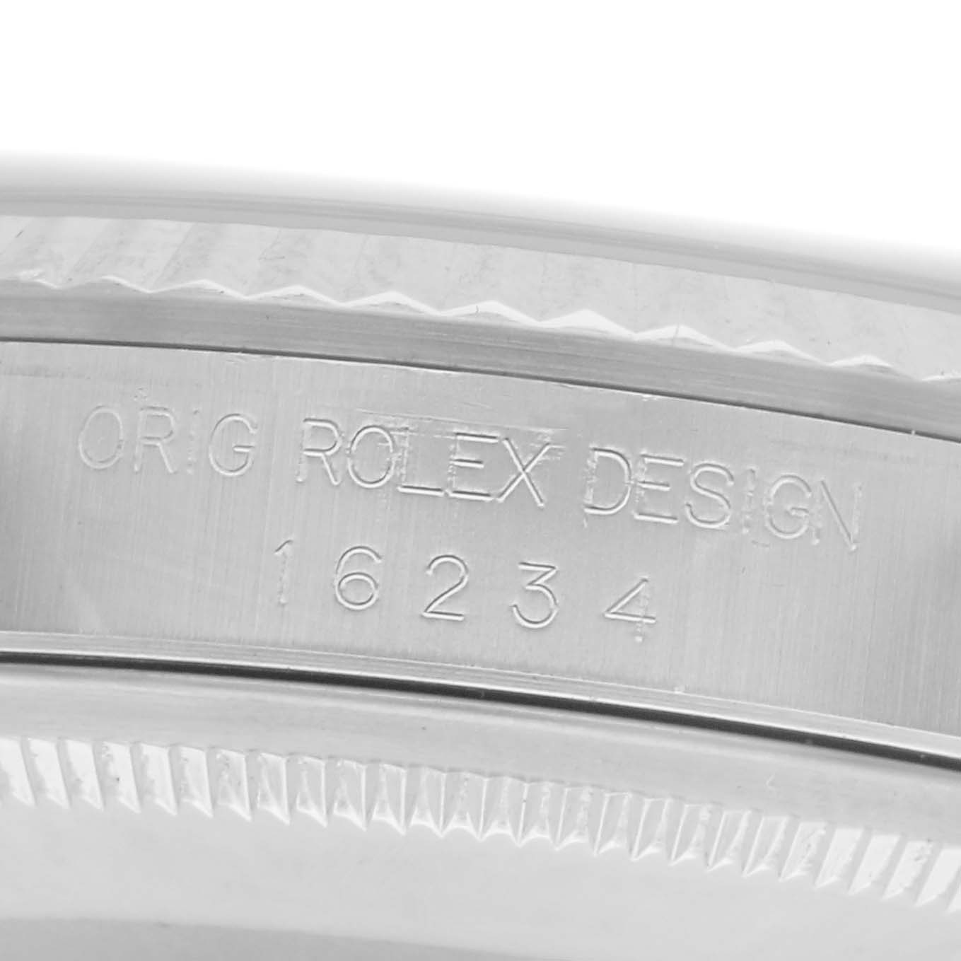 The image shows a close-up of the inner bezel of a Rolex Datejust, model number 16234, highlighting the engraving “ORIG ROLEX DESIGN 16234.”
