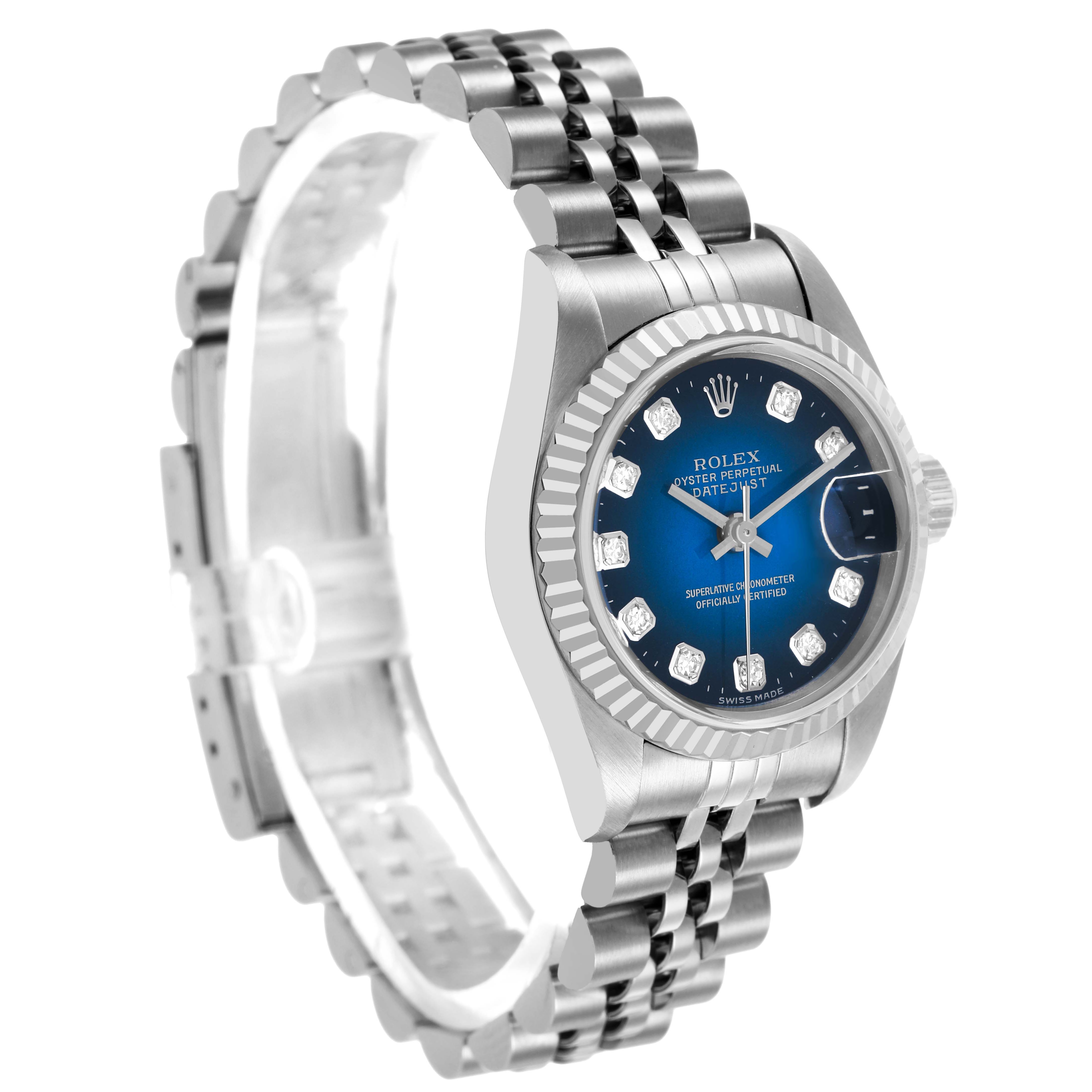 The Rolex Datejust 69174 Women's Stainless Steel Blue Dial watch is shown at an angle displaying the dial, bezel, and part of the bracelet.