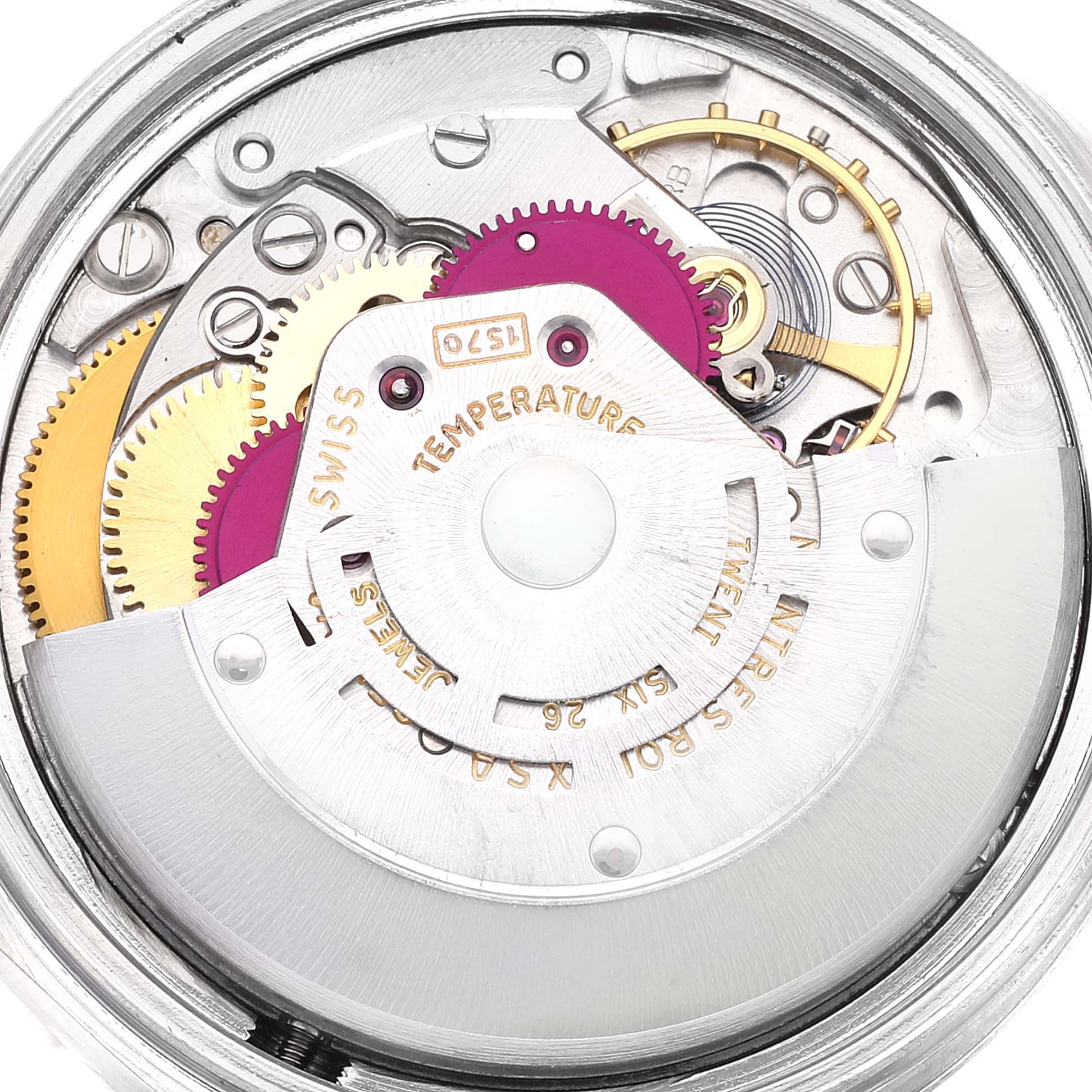 This close-up image shows the intricate internal mechanism of a Rolex Vintage Collection 1601 Men
s Stainless Steel Silver Dial 1601 Men
s Stainless Steel Silver Dial watch, highlighting gears and components.