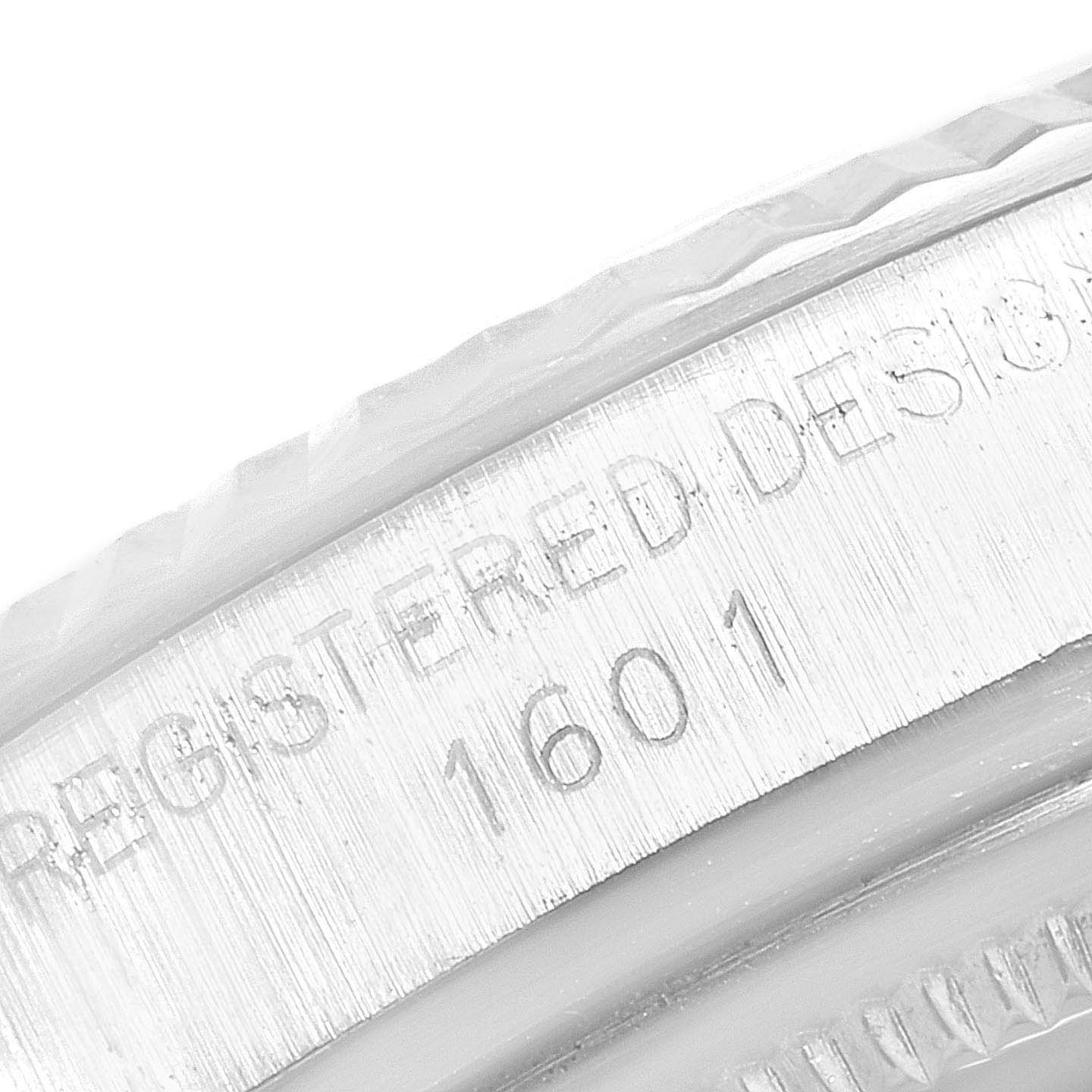 This image shows a close-up of the model and design number engraving on the bezel of a Vintage Collection Rolex watch.