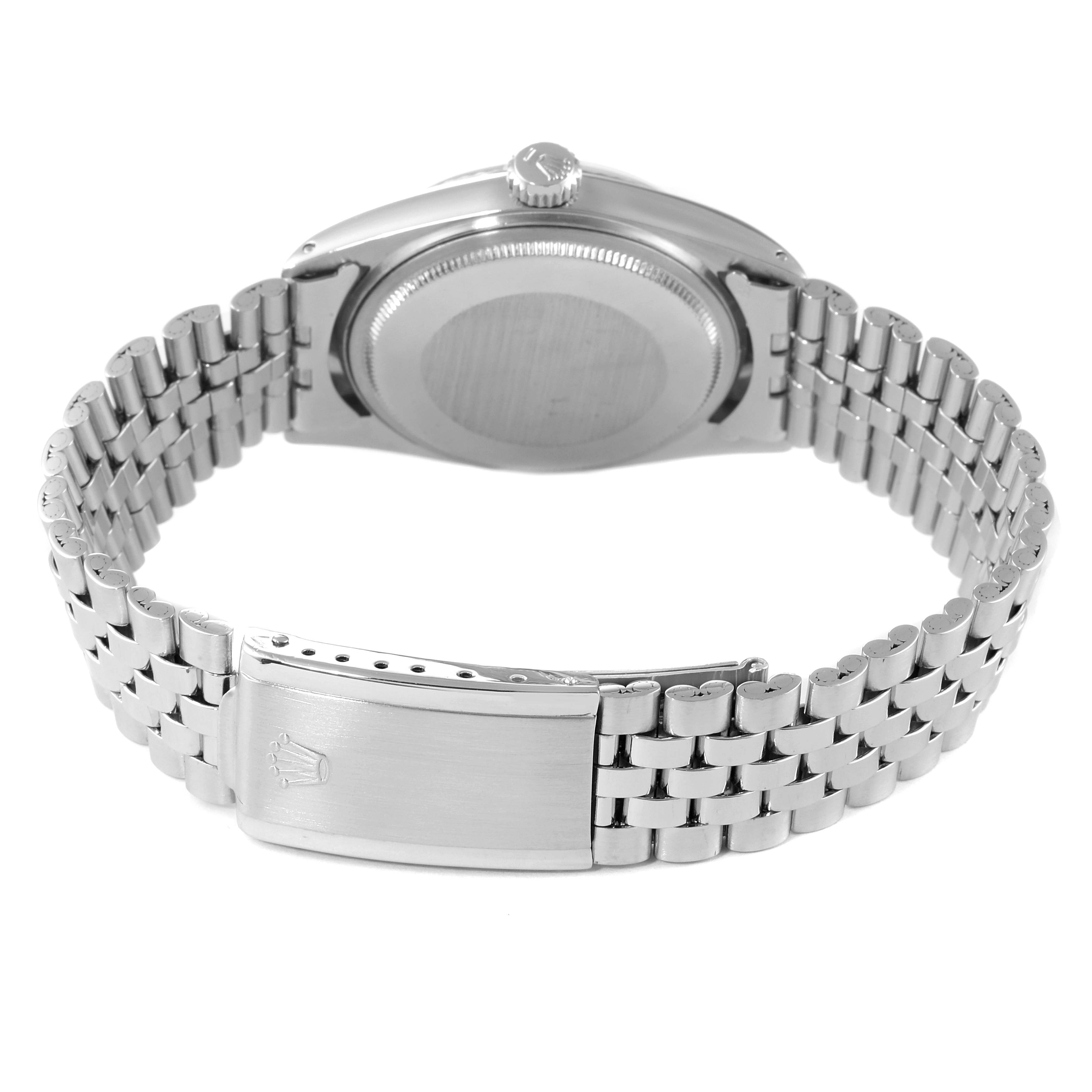 The image shows the back of a Rolex Datejust 1601 Men's Stainless Steel Silver Dial 1601 Men's Stainless Steel Silver Dial watch and its metal bracelet, highlighting the clasp and case back.