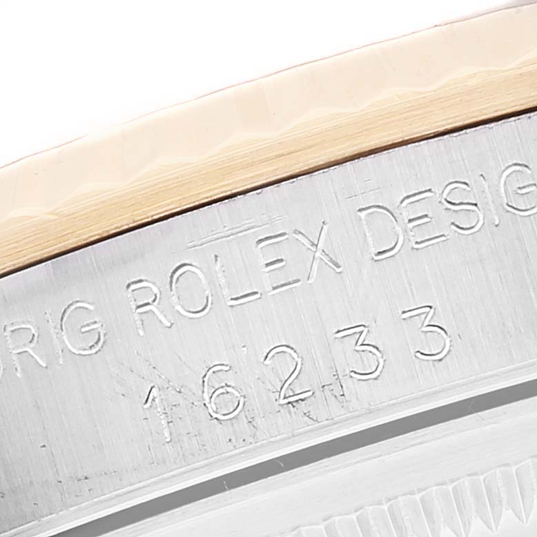 This close-up shows the engraved case and model number (16233) on the Rolex Datejust 16233 Men's Steel and Gold (two tone) Champagne Dial 16233 Men's Steel and Gold (two tone) Champagne Dial watch.