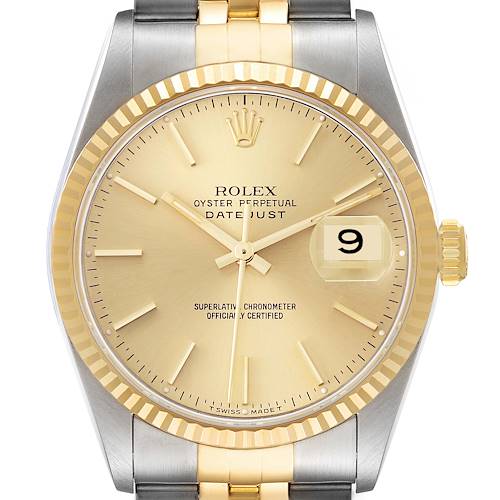 This is a close-up of a Rolex Datejust watch face, showcasing its gold dial, date display, and a two-tone bracelet.