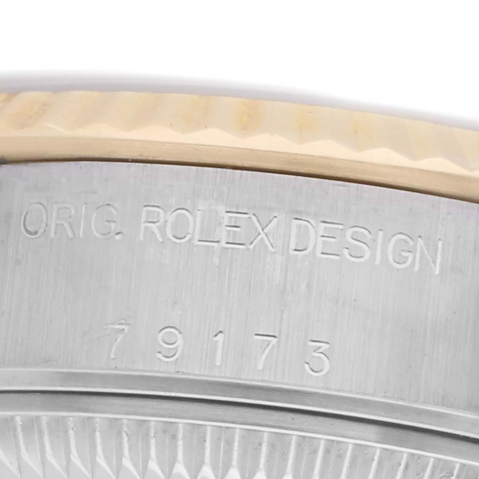 The image shows a close-up of the side of a Rolex Datejust watch, model number 79173, displaying the "ORIG. ROLEX DESIGN" engraving.