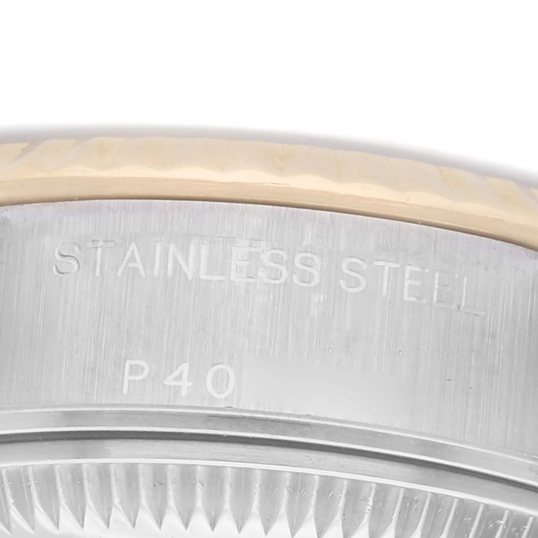 The image shows a close-up of the case side of a Rolex Datejust model 79173, highlighting the stainless steel material.