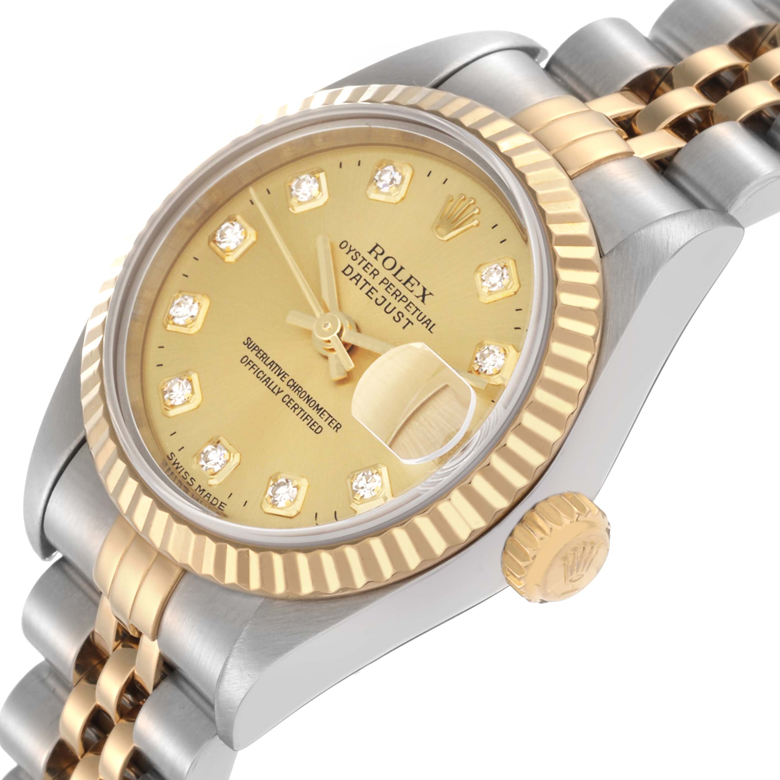 The image shows a Rolex Datejust model 79173 men's watch at an angled side view, highlighting its gold and silver finish, fluted bezel, and diamond markers.