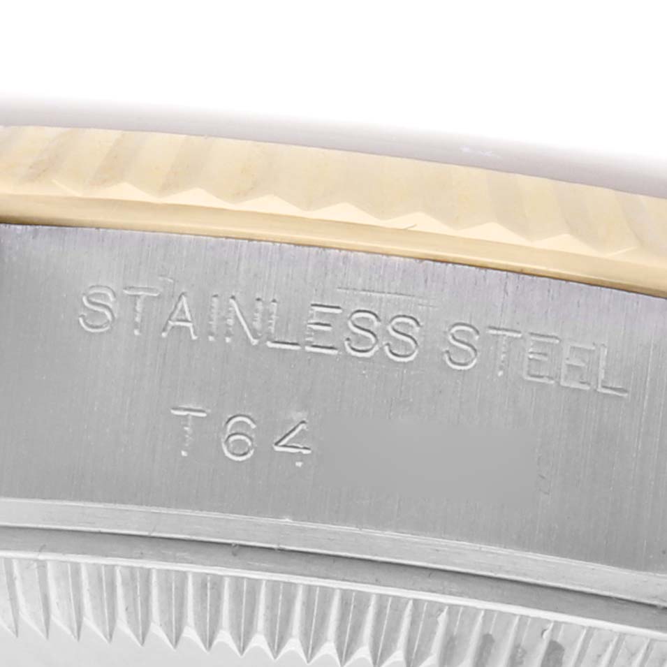 The image shows a close-up of the case back edge of a Rolex Datejust model 69173, highlighting the "Stainless Steel" engraving.