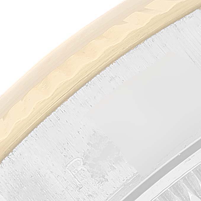 This image shows a close-up of the bezel of a Rolex Datejust 69173 Women's Steel and Gold (two tone) Champagne Dial 69173 Women's Steel and Gold (two tone) Champagne Dial watch.