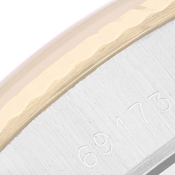 The image shows the edge of the case and part of the bezel with engraving of a Rolex Datejust 69173 Women's Steel and Gold (two tone) Champagne Dial 69173 Women's Steel and Gold (two tone) Champagne Dial model.