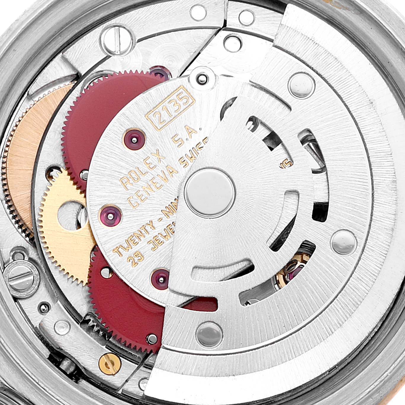The image shows an internal view of the Rolex Datejust 69173 Women's Steel and Gold (two tone) Champagne Dial 69173 Women's Steel and Gold (two tone) Champagne Dial watch, focusing on its intricate movement and gears.