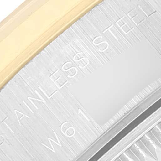 This close-up image shows the engraved "STAINLESS STEEL" text on the back of a Rolex Datejust 69173 Women's Steel and Gold (two tone) Grey Dial 69173 Women's Steel and Gold (two tone) Grey Dial watch.