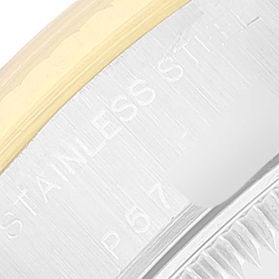 The image shows a close-up of the side of a Rolex Datejust 79173 Women's Steel and Gold (two tone) Silver Dial 79173 Women's Steel and Gold (two tone) Silver Dial watch, highlighting part of the bezel and inscribed markings on the case.