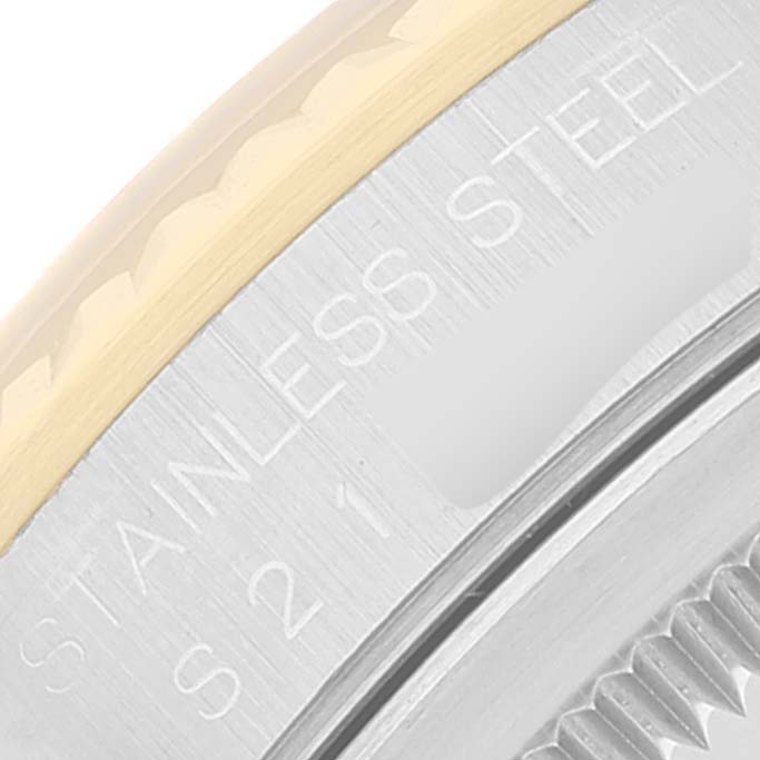 The image shows a close-up of the bezel and engraving on the side of a stainless steel Rolex Datejust 16233 Men's Steel and Gold (two tone) Silver Dial 16233 Men's Steel and Gold (two tone) Silver Dial watch.