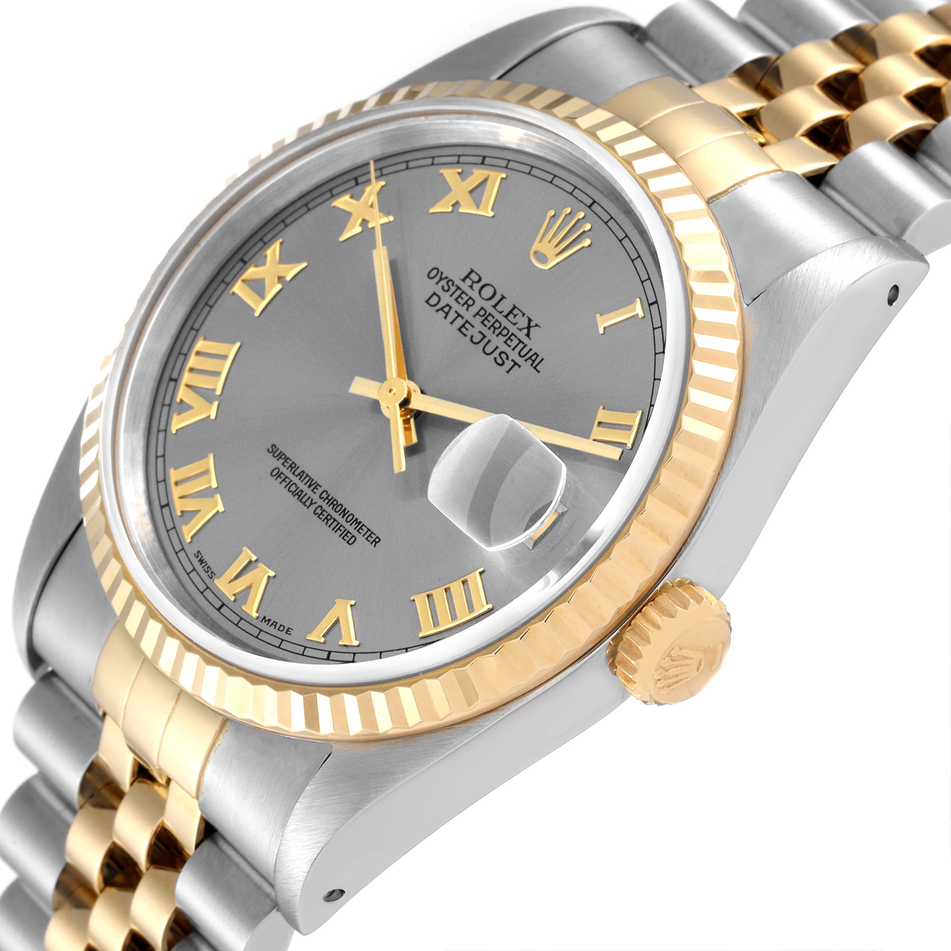 The Rolex Datejust 16233 Men's Steel and Gold (two tone) Silver Dial 16233 Men's Steel and Gold (two tone) Silver Dial is shown at a tilted angle, highlighting its dial, bezel, and part of the bracelet.