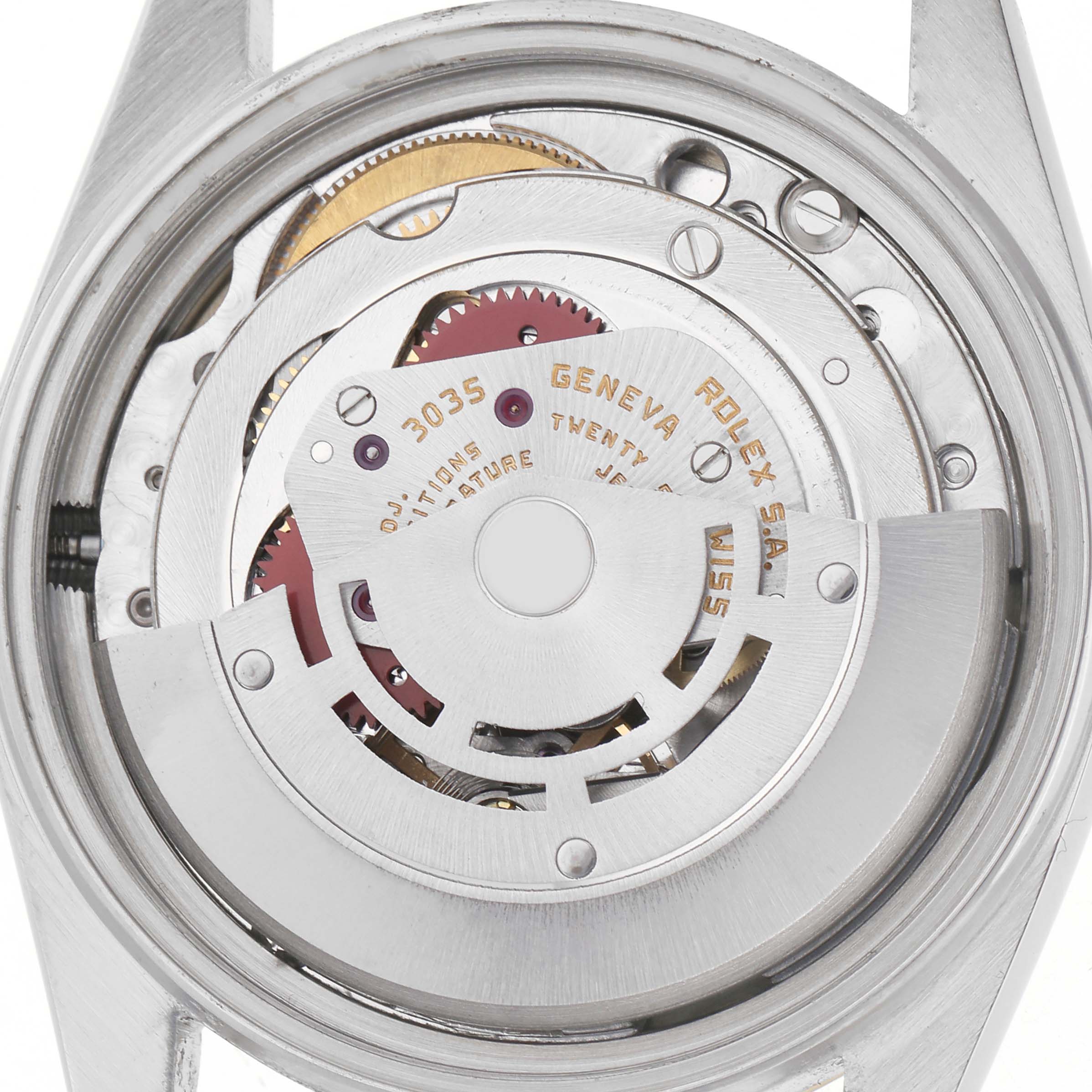 The image shows the movement mechanism of the Rolex Vintage Collection model 16013 men's watch from a top-down angle, highlighting gears and engravings.