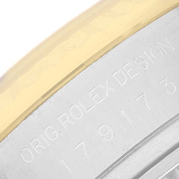 The image shows a close-up of the case and bezel of a Rolex Datejust 179173 Women's Steel and Gold (two tone) White Dial 179173 Women's Steel and Gold (two tone) White Dial watch, featuring the engraved text "ORIG. ROLEX DESIGN."