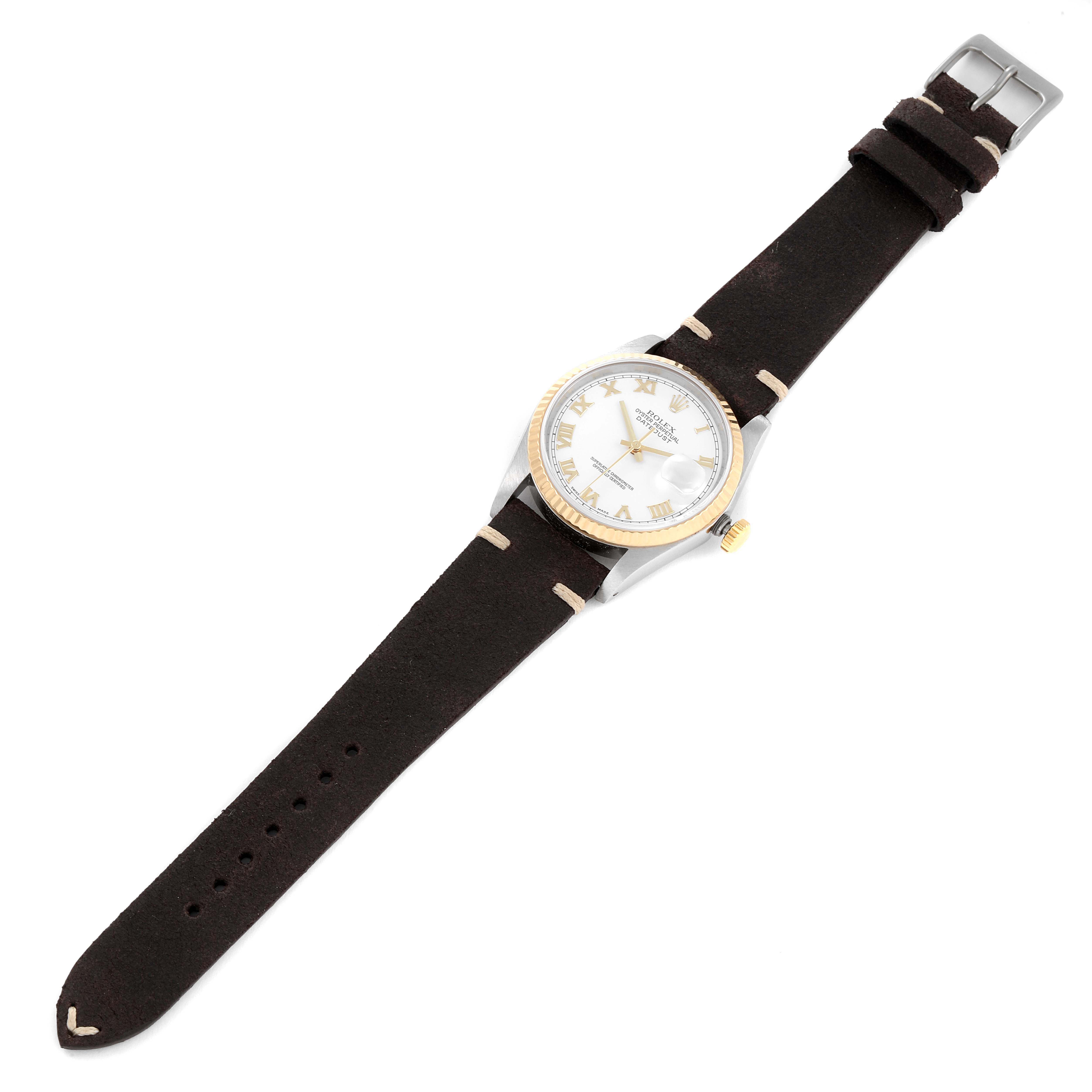 The watch is a Rolex Vintage Collection 16233 Men's Steel and Gold (two tone) White Dial 16233 Men's Steel and Gold (two tone) White Dial model shown from a top-down angle, featuring its dial, strap, and buckle.