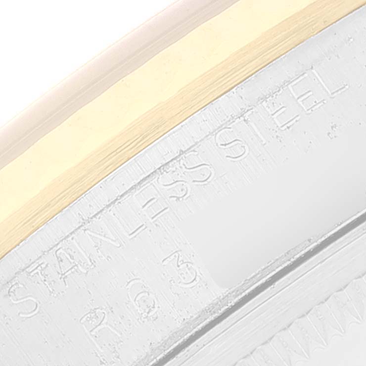 This close-up image shows the edge of a Rolex Vintage Collection 16233 Men's Steel and Gold (two tone) White Dial 16233 Men's Steel and Gold (two tone) White Dial model watch, highlighting the stainless steel bezel.