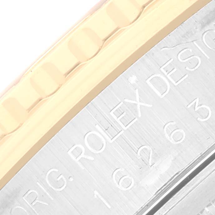This image shows a close-up of the engraved side of a Rolex Turn-o-Graph 16263 Men
s Steel and Gold (two tone) White Dial 16263 Men
s Steel and Gold (two tone) White Dial watch, highlighting the bezel and case details.