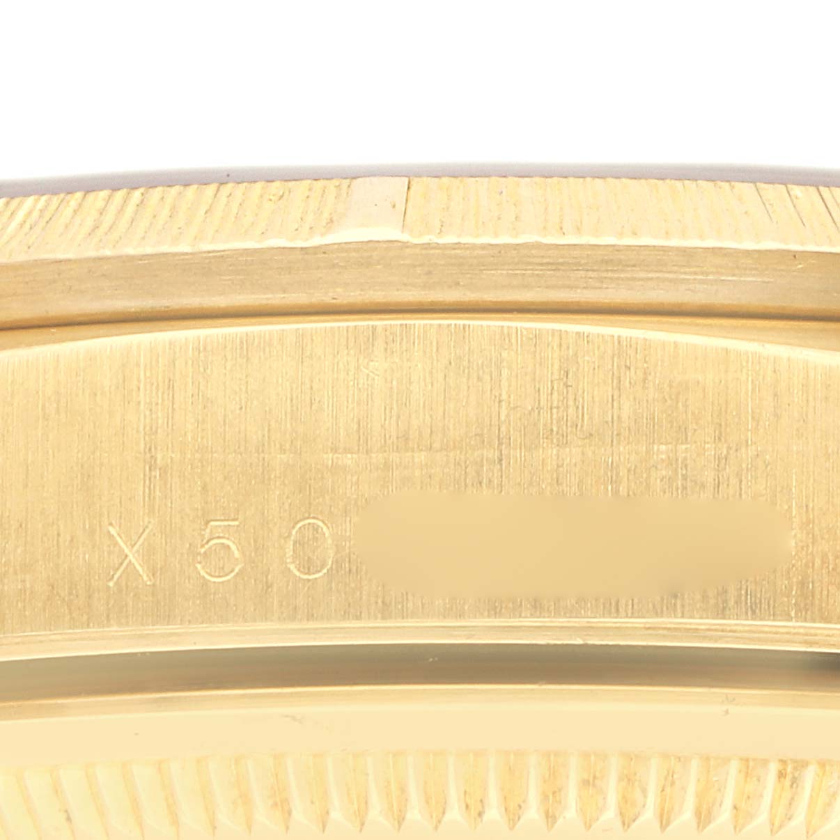 The image shows a close-up of the side of a Rolex President model 18248, highlighting the edge and part of the case with engraved details.