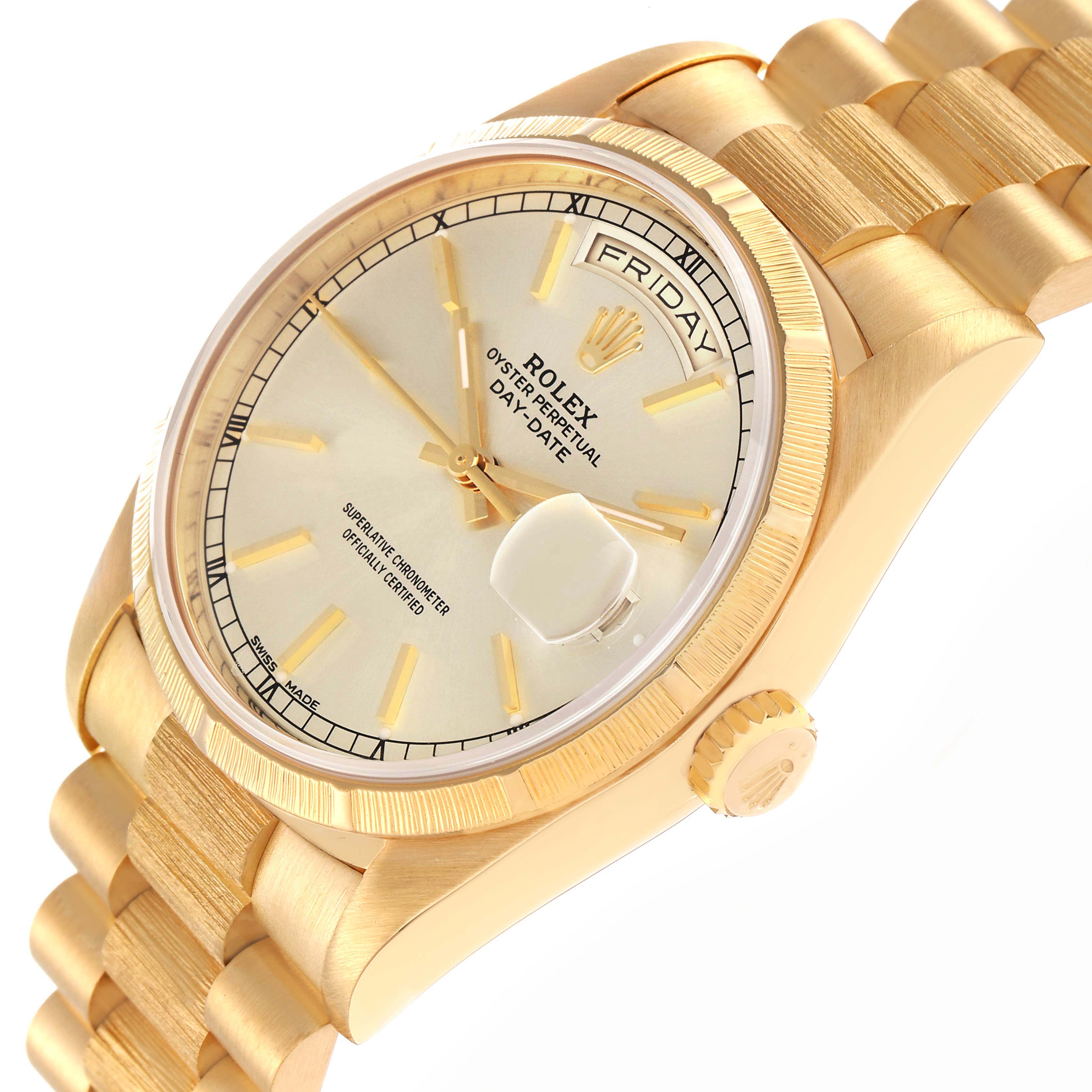 The Rolex President model 18248 is shown at an angled view, highlighting the dial, fluted bezel, day-date feature, and part of the gold bracelet.
