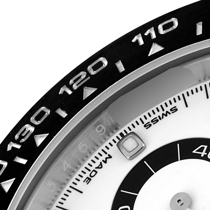 Close-up of a Rolex Daytona 116500LN Men's Stainless Steel White Dial 116500LN Men's Stainless Steel White Dial showing part of the bezel with numerals and inner watch face.