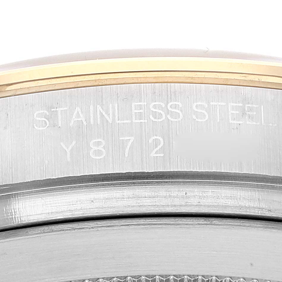 This image shows a close-up of the case back edge of a Rolex Daytona 116523 Men's Steel and Gold (two tone) Grey Dial 116523 Men's Steel and Gold (two tone) Grey Dial, featuring the stainless steel engraving and partial serial number.