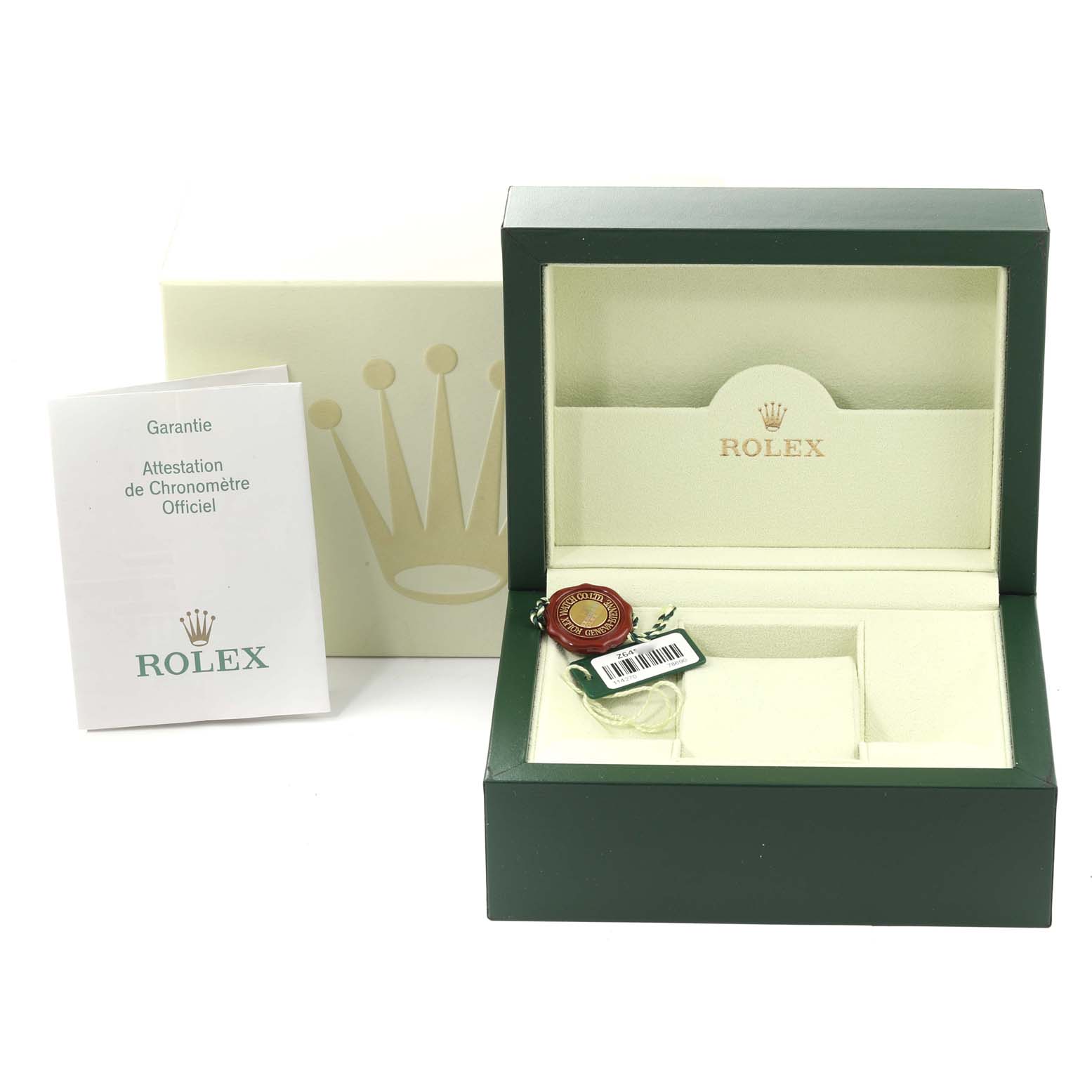 This image shows the packaging and accessories for a Rolex Daytona 116520 Men's Stainless Steel White Dial 116520 Men's Stainless Steel White Dial watch including the box, guarantee booklet, and tags.