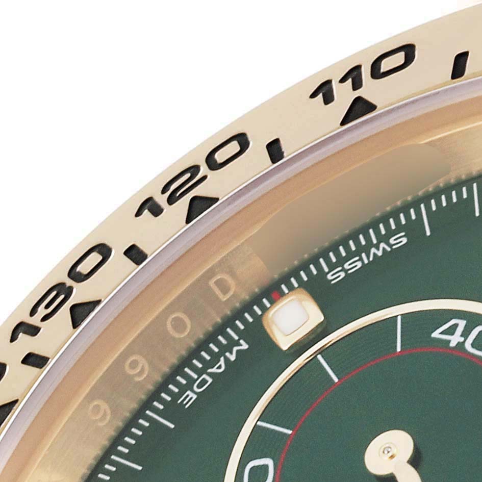 This image shows a close-up of the bezel and part of the dial on the Rolex Daytona 116508 Men's Yellow Gold Green Dial 116508 Men's Yellow Gold Green Dial watch.