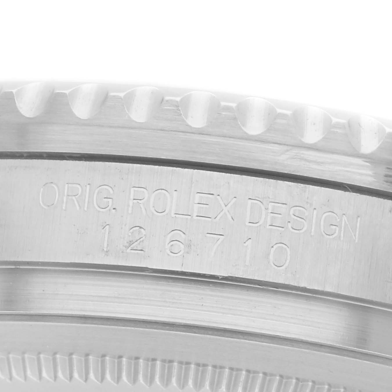 The image shows a close-up side view of the Rolex GMT-Master watch, model number 126710, focusing on the engraved model details.