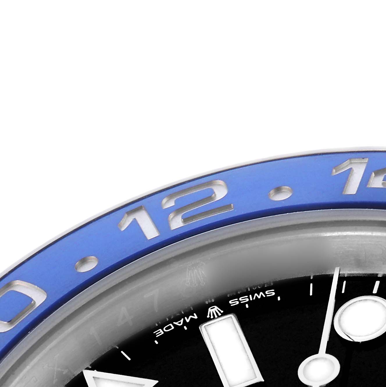 The image shows a close-up of the bezel and part of the dial of a Rolex GMT-Master model, model number 126710, with visible numbers and markers.