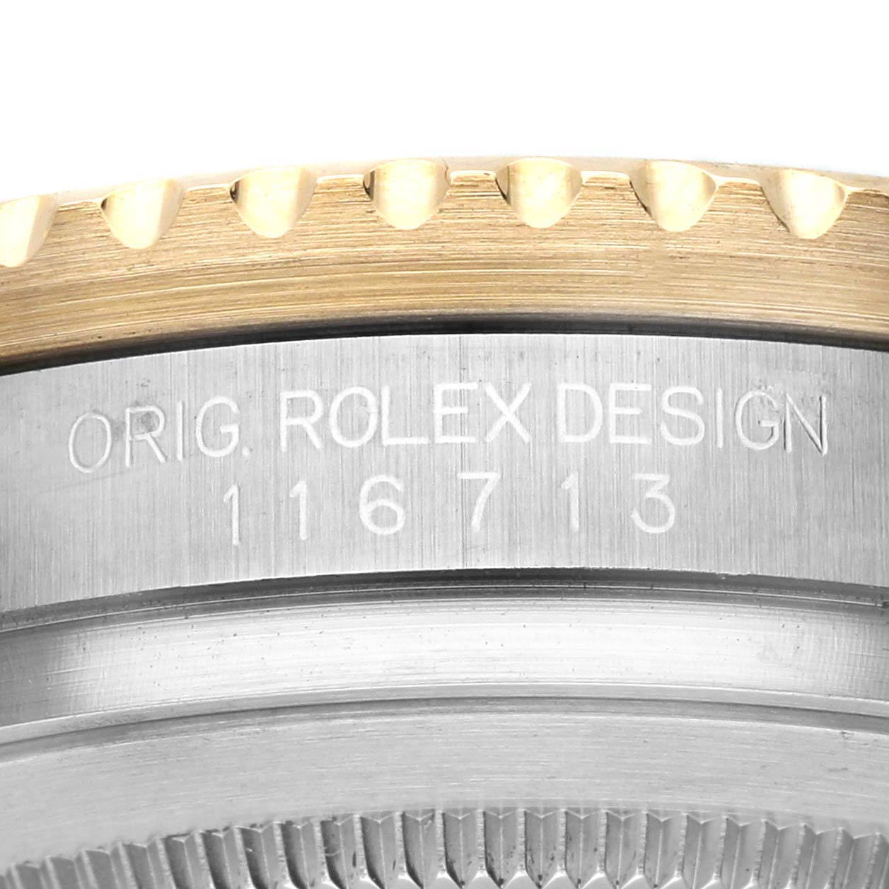 The image shows a close-up of the side of a Rolex GMT-Master 116713LN Men's Stainless Steel Black Dial's bezel and case, featuring the model number and "ORIG. ROLEX DESIGN" engraving.