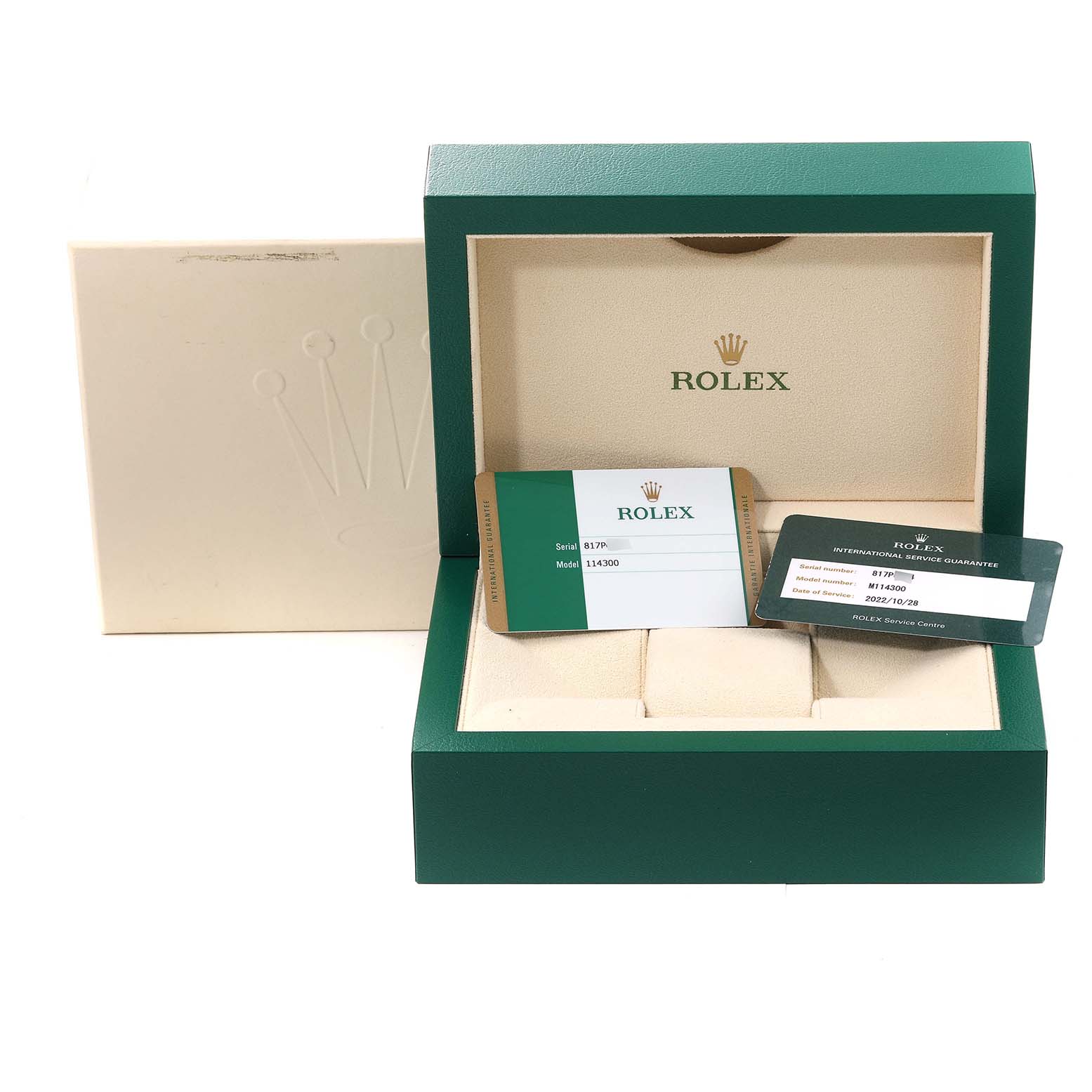 The image shows an open Rolex Oyster Perpetual 114300 Men's Stainless Steel Grey Dial 114300 Men's Stainless Steel Grey Dial box with warranty cards displayed inside and outside of the box.