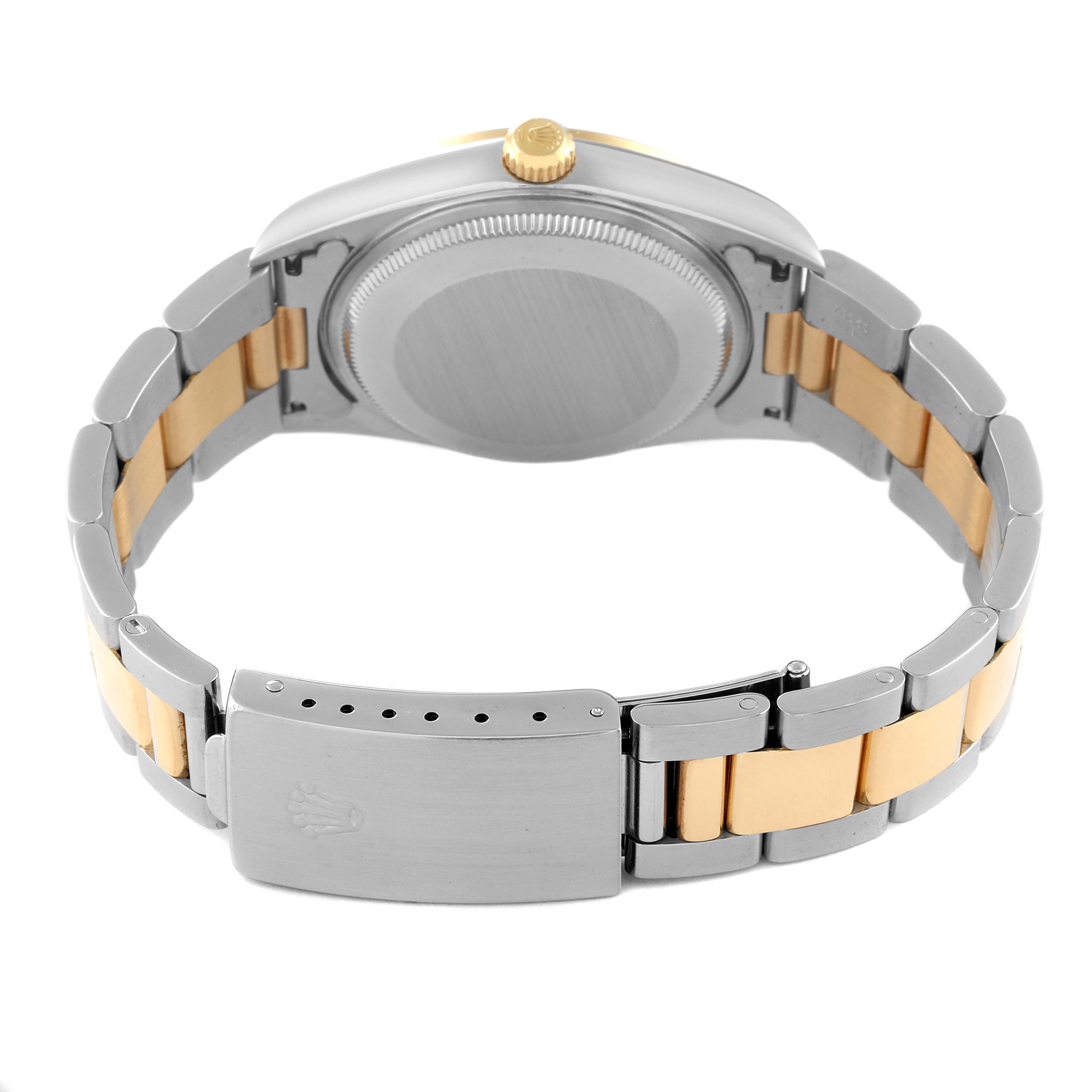 This image shows the back view of a Rolex Oyster Perpetual 14203 Men's Steel and Gold (two tone) Black Dial 14203 Men's Steel and Gold (two tone) Black Dial watch, highlighting the clasp, bracelet, and caseback.