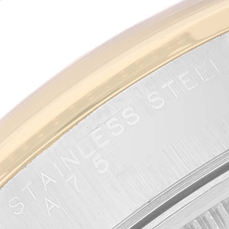 The image shows a close-up of the case back edge and the "STAINLESS STEEL" engraving on the Rolex Oyster Perpetual 14203 Men's Steel and Gold (two tone) Black Dial 14203 Men's Steel and Gold (two tone) Black Dial watch.
