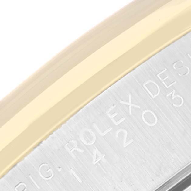 The image shows a close-up of the side of a Rolex Oyster Perpetual 14203 Men's Steel and Gold (two tone) Black Dial 14203 Men's Steel and Gold (two tone) Black Dial watch, focusing on the engraved text and metal edge.